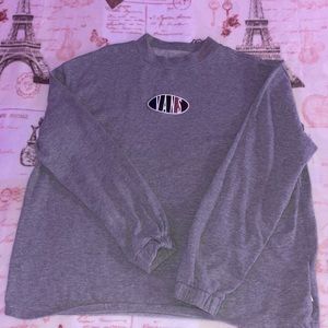 Grey Long sleeve Vans shirt.